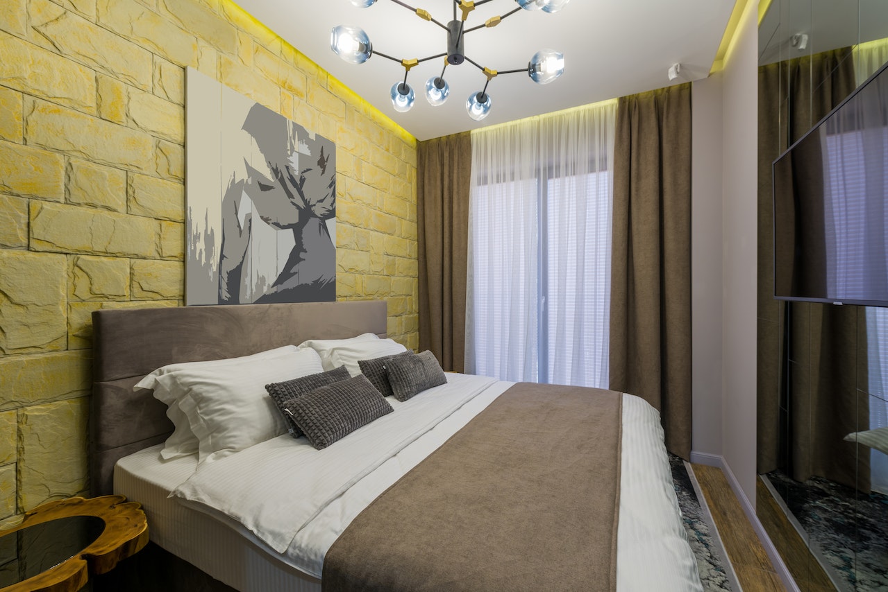 bedroom with yellow brick wall