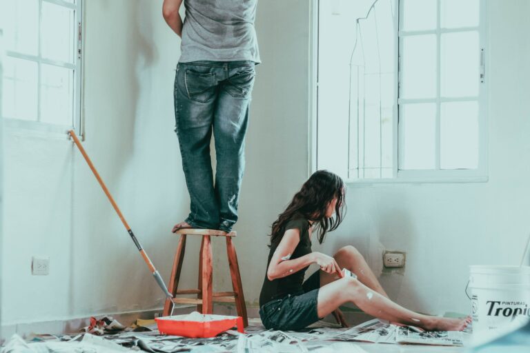 man and woman painting
